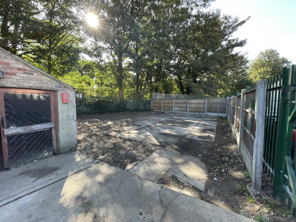 Lot: 53 - GATED STORAGE AND WORKSHOP YARD WITH POTENTIAL - View looking into yard from gates